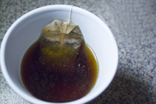 Infusion bag inside a cup with hot water