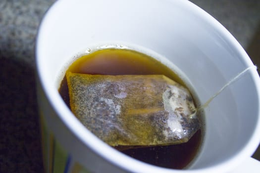 Infusion bag inside a cup with hot water