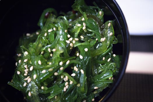 Container with wakame seaweed