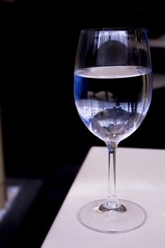 Glass of water resting on a restaurant table