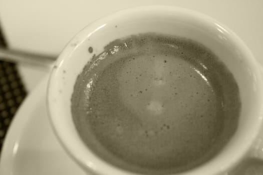 Hot coffee drink in a white cup