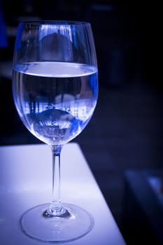 Glass of water resting on a restaurant table