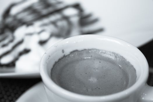 Hot coffee drink in a white cup