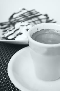 Hot coffee drink in a white cup