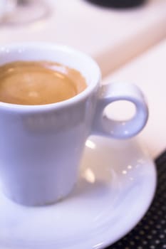 Hot coffee drink in a white cup