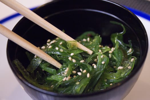 Container with wakame seaweed