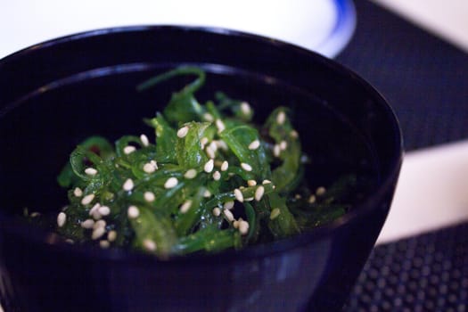 Container with wakame seaweed