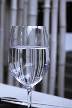 Glass of water resting on a restaurant table