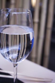 Glass of water resting on a restaurant table