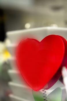 Red shape heart on white plate background