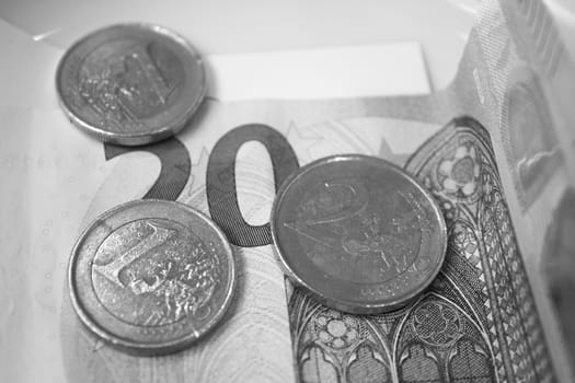 Banknotes and euros on plate