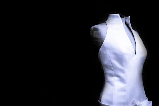 Mannequin with white basic wedding dress