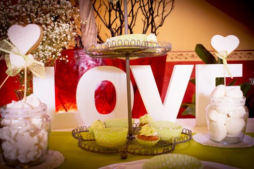 Wedding table with sweets and the word love