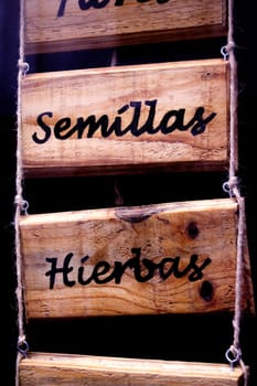 Wooden poster with infusions written in spanish