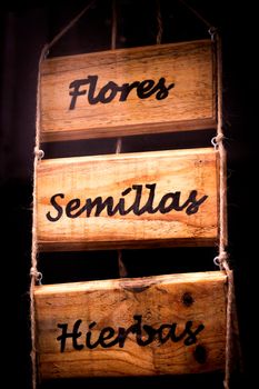 Wooden poster with infusions written in spanish