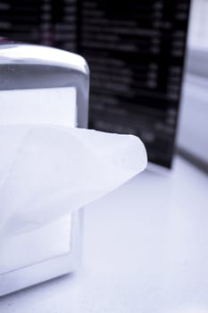Napkin coming out of a napkin maker