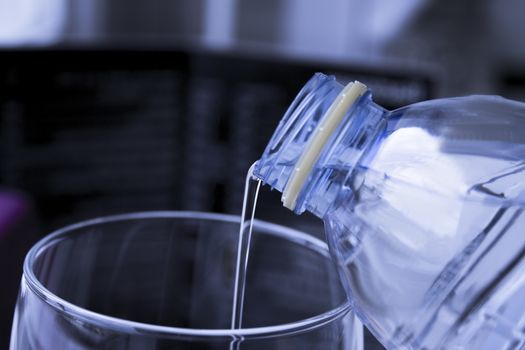 Open water bottle to serve in a glass