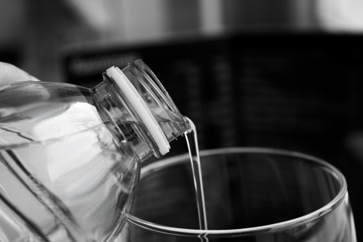 Open water bottle to serve in a glass