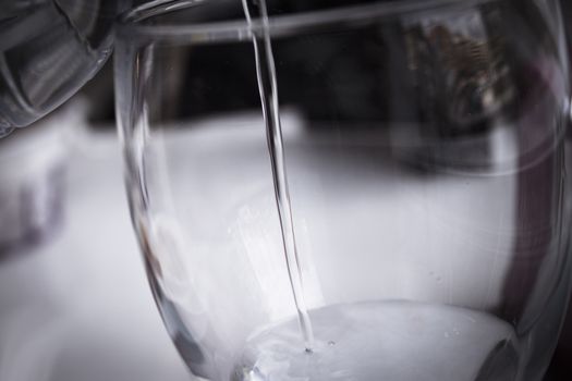 Open water bottle to serve in a glass