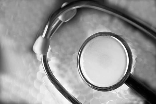 Stethoscope on multicolored background out of focus