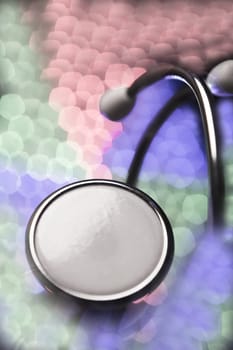 Stethoscope on multicolored background out of focus