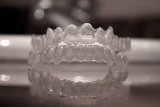 Invisible orthodontics for aligning teeth