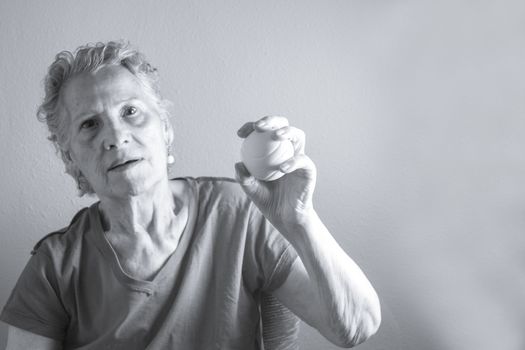 Rehabilitation exercises for an older woman with cerebral stroke