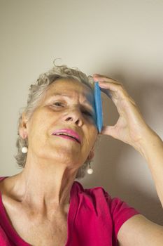 Ice pack for headache in older woman