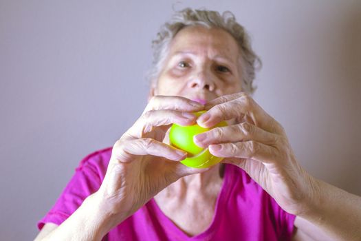Rehabilitation exercises for an older woman with cerebral stroke