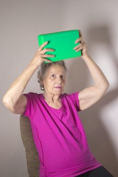 Rehabilitation for elderly woman with cerebral stroke with yoga exercises