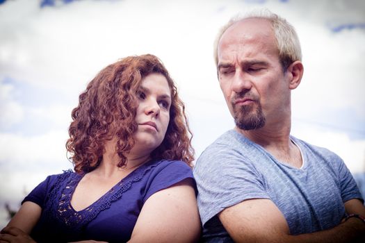 Couple in negative attitude angry transmitting emotional tension