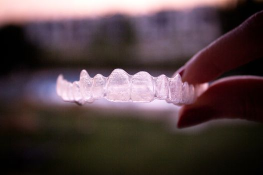 Invisible orthodontics for aligning teeth