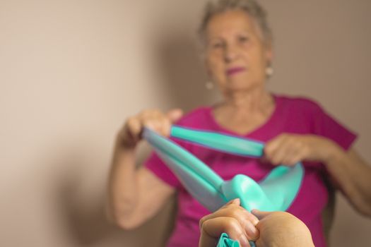Rehabilitation exercises for older women with elastic band