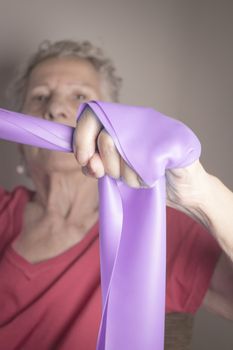 Rehabilitation exercises for older women with elastic band