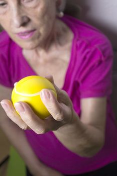 Rehabilitation exercises for an older woman with cerebral stroke