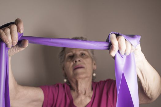 Rehabilitation exercises for older women with elastic band