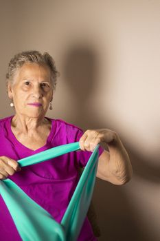 Rehabilitation exercises for older women with elastic band