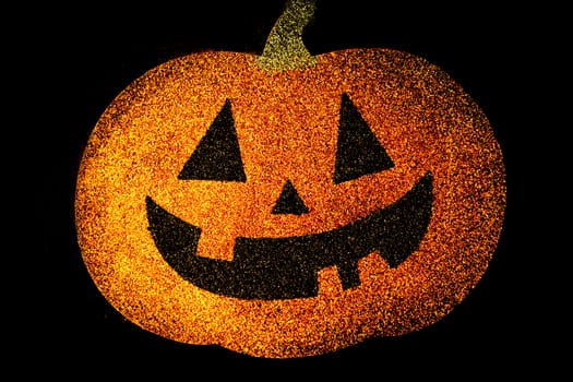 Pumpkin with face drawn for halloween.