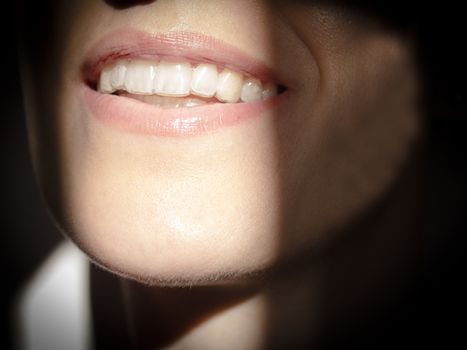 Smile of woman with perfectly aligned teeth and white teeth