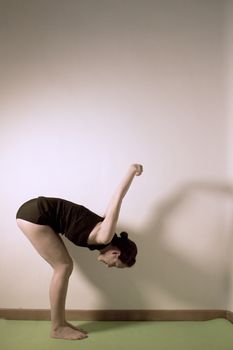 Individual yoga practice performed by a woman