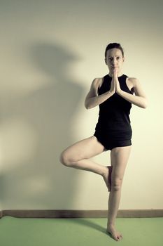 Individual yoga practice performed by a woman