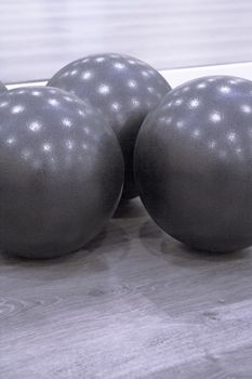 Medium size black balls for pilates exercises