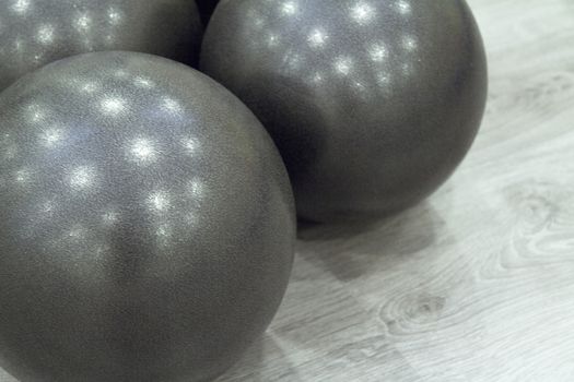Medium size black balls for pilates exercises