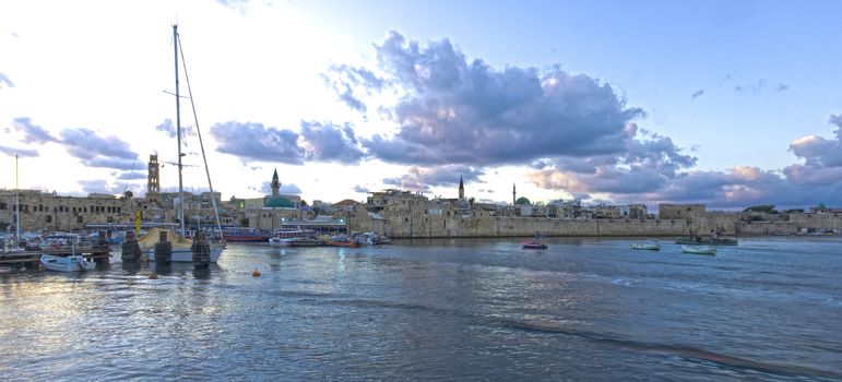The fishing harbor and the old sea wall in the old city of Acre, Israel