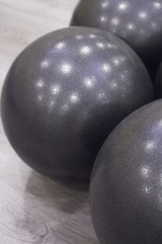 Medium size black balls for pilates exercises