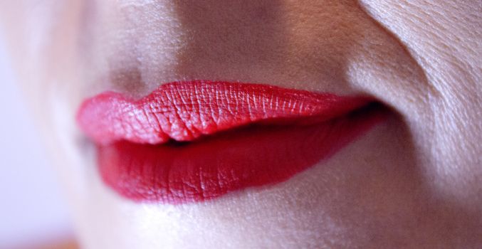 Red lips of young woman