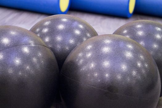 Medium size black balls for pilates exercises