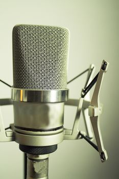 Professional microphone silver on white background