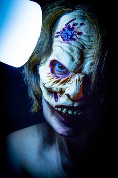 Portrait of a zombie woman at halloween party