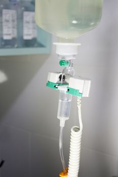 Plastic bottle of serum in surgical operation